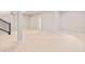Spacious carpeted basement area featuring a staircase and doorways at 251 Washington St, Erie, CO 80516