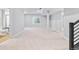 Finished basement area with neutral carpeting and stairway access at 251 Washington St, Erie, CO 80516