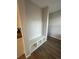 Cozy entryway featuring a built-in bench with storage cubbies and hardwood flooring at 251 Washington St, Erie, CO 80516