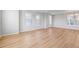 Bright living room featuring hardwood floors, recessed lighting, and natural light through large windows at 251 Washington St, Erie, CO 80516