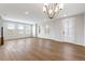 Spacious living room with hardwood floors, recessed lighting, and many windows at 251 Washington St, Erie, CO 80516