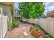 This home features a well-maintained backyard and brick patio, perfect for outdoor relaxation at 9270 107Th E Pl, Commerce City, CO 80640