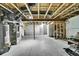 Unfinished basement with exposed wood ceiling, utilities, and plenty of potential at 9270 107Th E Pl, Commerce City, CO 80640