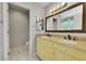 A bright bathroom features a dual sink vanity with modern fixtures and updated countertops at 9270 107Th E Pl, Commerce City, CO 80640