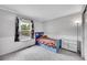 A bedroom with a single bed, window, and dresser shows comfortable living space at 9270 107Th E Pl, Commerce City, CO 80640
