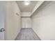 A walk-in closet is carpeted, has shelving, and a hanging bar for extra storage at 9270 107Th E Pl, Commerce City, CO 80640