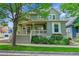 Charming two-story home with landscaped front yard and inviting covered porch at 9270 107Th E Pl, Commerce City, CO 80640