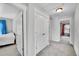A hallway with white trim provides access to bedrooms with closets, showcasing functional living at 9270 107Th E Pl, Commerce City, CO 80640