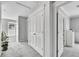 Upstairs hallway features two large closets and trim, with a plant accenting the window at 9270 107Th E Pl, Commerce City, CO 80640