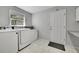 Functional laundry room with a washer, dryer, and ample storage space at 9270 107Th E Pl, Commerce City, CO 80640