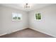 Bright bedroom featuring neutral walls and carpet at 5559 S Lowell Blvd, Littleton, CO 80123