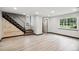 Living room featuring a wood accent wall and an entrance at 5559 S Lowell Blvd, Littleton, CO 80123