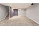 The finished basement provides additional living space with neutral colors and direct access to storage and stairs at 6492 Simms St # A, Arvada, CO 80004