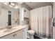 Bathroom featuring vanity and shower/tub combo with unique curtain at 6492 Simms St # A, Arvada, CO 80004