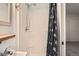 Bathroom features shower, sink and decorative shower curtain at 6492 Simms St # A, Arvada, CO 80004