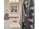 Bathroom with sink, mirror, towel and shower curtain at 6492 Simms St # A, Arvada, CO 80004