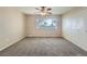 Spacious bedroom with ceiling fan, double closets, carpet and bright window at 6492 Simms St # A, Arvada, CO 80004