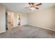 Bedroom featuring carpet with access to bathroom at 6492 Simms St # A, Arvada, CO 80004