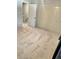 Bedroom with neutral carpet, closet with folding doors, and an open door to the hallway at 6492 Simms St # A, Arvada, CO 80004