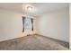 Bedroom with carpet and window showing some trees at 6492 Simms St # A, Arvada, CO 80004