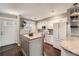 Charming kitchen with white cabinets, a wood-topped island, and a cozy breakfast nook at 6492 Simms St # A, Arvada, CO 80004