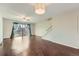 Bright living room boasts hardwood floors, a ceiling fan, and sliding doors to the backyard at 6492 Simms St # A, Arvada, CO 80004