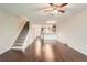 Inviting living room featuring wood floors and an open floor plan to kitchen at 6492 Simms St # A, Arvada, CO 80004