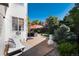 A cozy patio with comfortable lounge seating and an umbrella for shade at 2880 Breezy Ln, Castle Rock, CO 80109