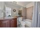 Bright bathroom includes tub-shower combo, commode, sink vanity and large mirror at 2880 Breezy Ln, Castle Rock, CO 80109