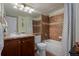 Bathroom features a vanity, a large mirror, and a shower-tub with a curtain at 2880 Breezy Ln, Castle Rock, CO 80109