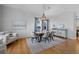 Elegant dining room with hardwood floors, stylish light fixture, modern decor and large windows at 2880 Breezy Ln, Castle Rock, CO 80109