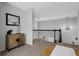 Upstairs hallway boasts modern decor, a stylish light fixture, and leads to the bedrooms and bathrooms at 2880 Breezy Ln, Castle Rock, CO 80109