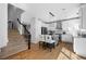 Modern kitchen with white cabinets, stainless steel appliances, and an island with bar seating at 2880 Breezy Ln, Castle Rock, CO 80109