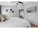 Bright main bedroom features vaulted ceilings with ceiling fan, neutral paint, carpet and ensuite bathroom at 2880 Breezy Ln, Castle Rock, CO 80109