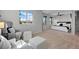 Bright main bedroom featuring an inviting seating area and natural light through large windows at 2880 Breezy Ln, Castle Rock, CO 80109