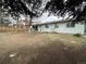 Large, grassy backyard features a patio and established landscaping at 16180 E Flora Pl, Aurora, CO 80013