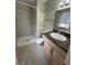 Updated bathroom with a walk-in shower and a granite countertop vanity at 16180 E Flora Pl, Aurora, CO 80013