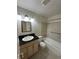 Well-maintained bathroom featuring a vanity with a dark countertop and tiled shower-tub combination at 16180 E Flora Pl, Aurora, CO 80013