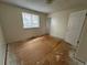 Bright bedroom with a window, awaiting new flooring and personalization at 16180 E Flora Pl, Aurora, CO 80013