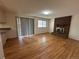 Living room with hardwood floors and a brick fireplace at 16180 E Flora Pl, Aurora, CO 80013