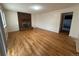 Spacious living room featuring a brick fireplace, hardwood floors, and ample natural light at 16180 E Flora Pl, Aurora, CO 80013
