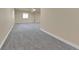 Spacious basement area with ample room for activities, featuring neutral walls and carpeting at 10052 Isle St, Parker, CO 80134