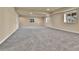 Large, open basement with neutral carpeting and recessed lighting at 10052 Isle St, Parker, CO 80134