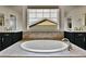 Beautiful main bathroom has a large soaking tub and lots of natural light at 10052 Isle St, Parker, CO 80134
