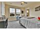 Bright bedroom featuring multiple windows offering outside views, and comfortable carpet at 10052 Isle St, Parker, CO 80134