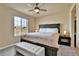 Relaxing main bedroom with a large window for natural light and a cozy bench at 10052 Isle St, Parker, CO 80134