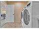 Convenient laundry room with side-by-side washer and dryer at 10052 Isle St, Parker, CO 80134