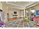 Bright, spacious living room with hardwood floors and large windows, offering versatile layout options for relaxation at 10052 Isle St, Parker, CO 80134