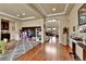 Open living space with hardwood floors, playroom area, and staircase, perfect for Gathering gatherings and entertaining at 10052 Isle St, Parker, CO 80134