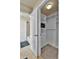 View of a bright walk-in closet with built in shelving and drawers adjacent to the bathroom at 10052 Isle St, Parker, CO 80134